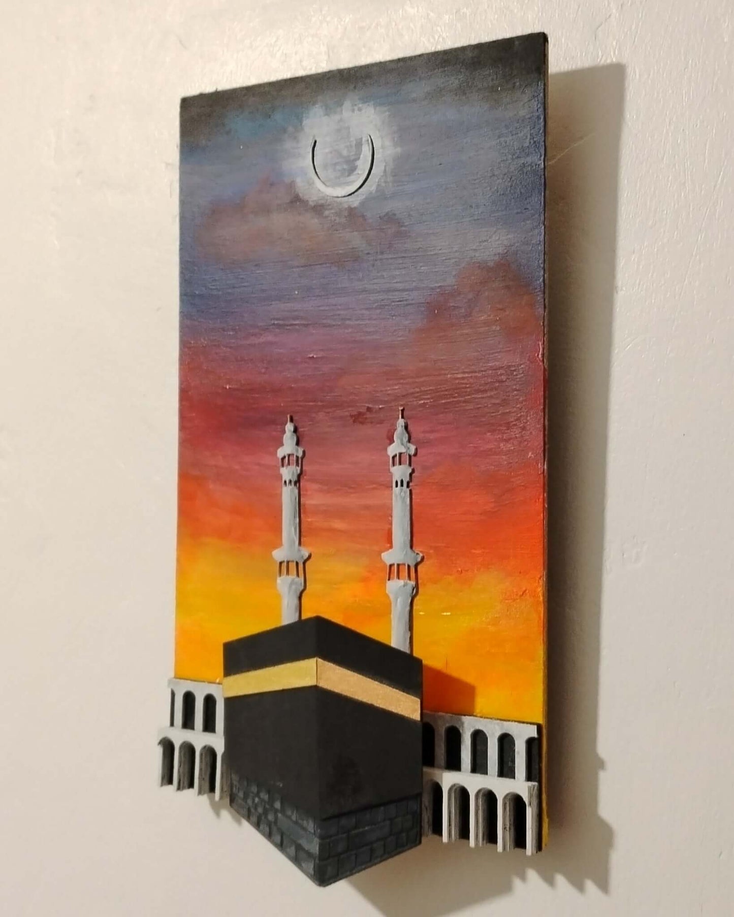 Kabah 3D laser cut wall sculpture depicting the iconic pilgrimage site with intricate details and vibrant sunset colors.