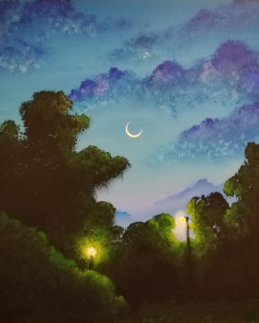 A vertical canvas painting of a night landscape, featuring dark green trees silhouetted against a blue and purple sky with a crescent moon and glowing streetlights, displayed on a beige wall.