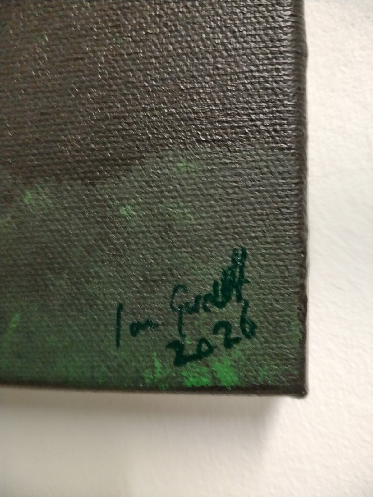 Signature of Ian Garrett on canvas from the 2026 acrylic painting 'Dawn'.