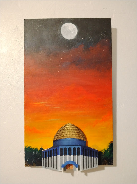 A vertical canvas painting of a domed building at sunset, with a bright moon in the dark sky above. The painting is mounted on a textured off-white wall.