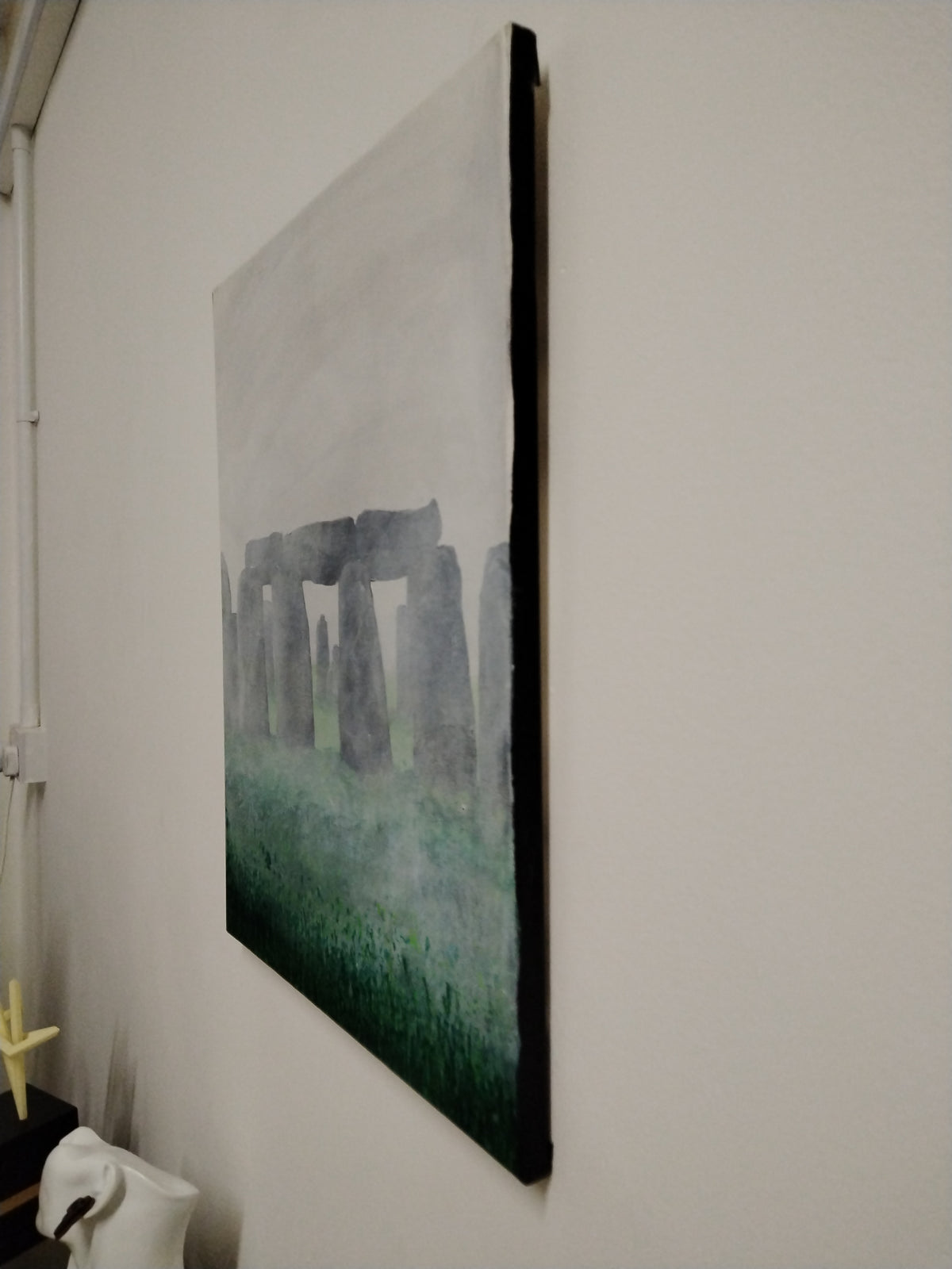 Stonehenge Fog - Original Painting by Ian Garrett depicting Stonehenge shrouded in fog on a wall.